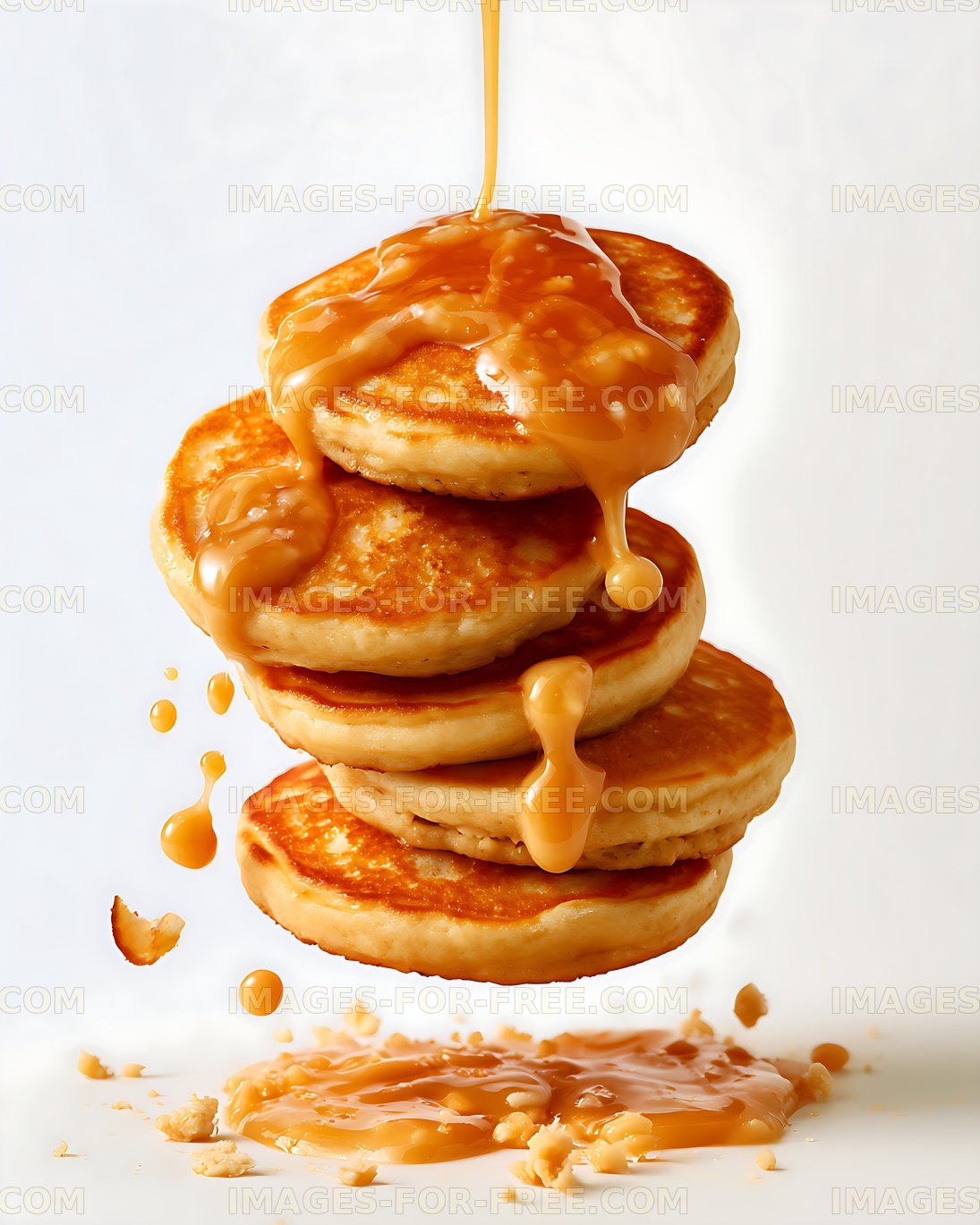 Golden pancake stack covered in flowing caramel syrup