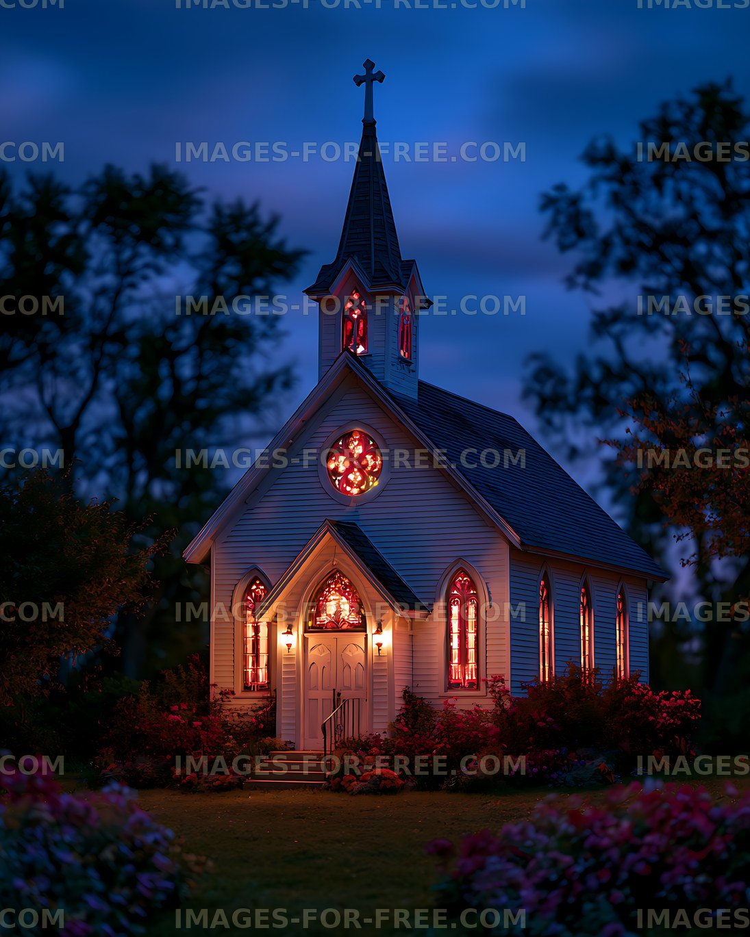 Gothic chapel with illuminated stained glass at dusk