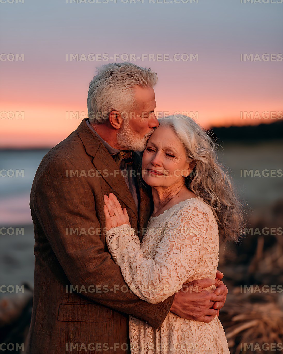 Loving senior couple sharing an embrace at sunset