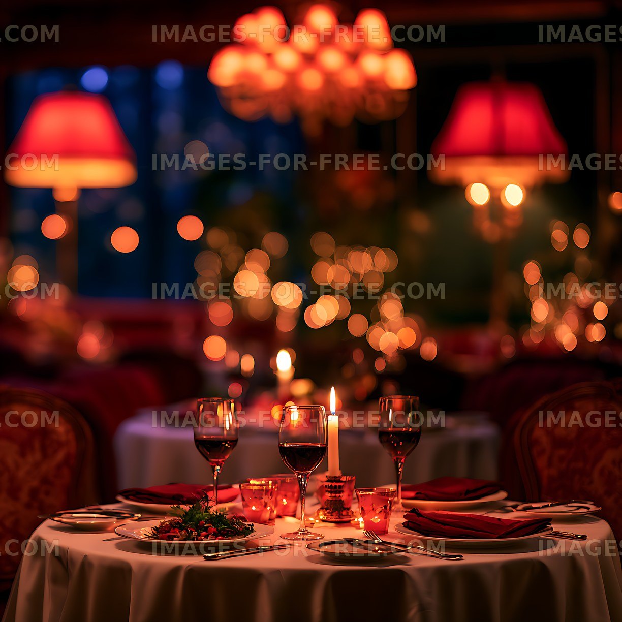 Elegant candlelit dinner setting with wine glasses