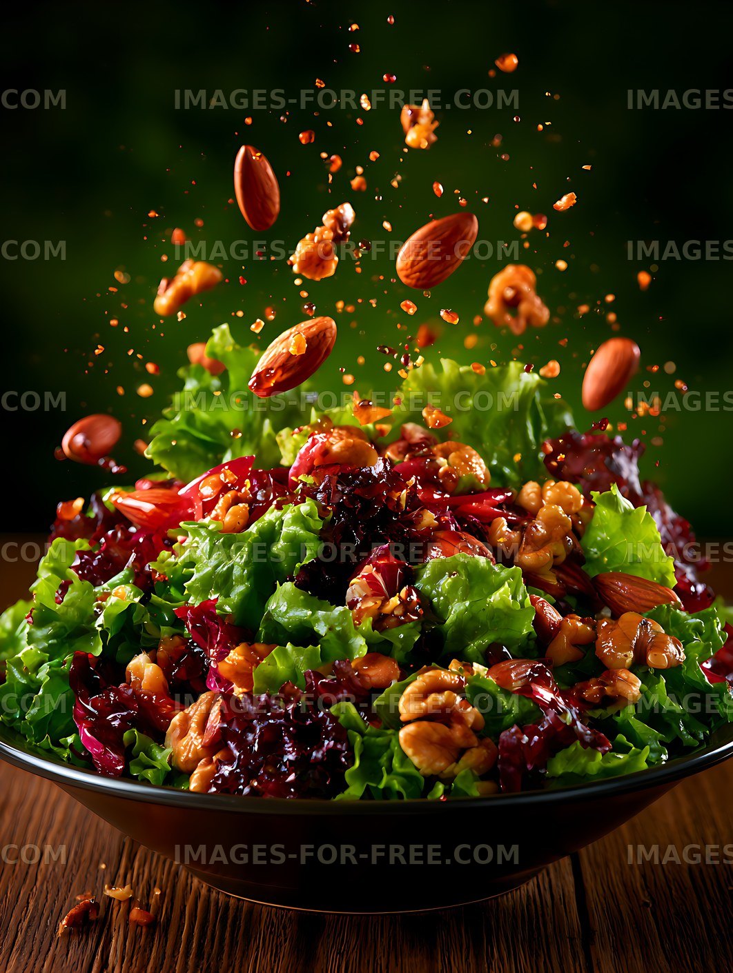 Fresh green salad with nuts and ingredients in motion