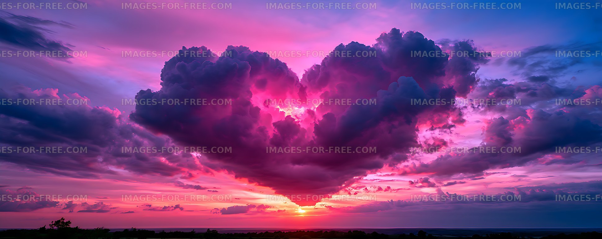 Colorful dramatic sunset over ocean with towering clouds