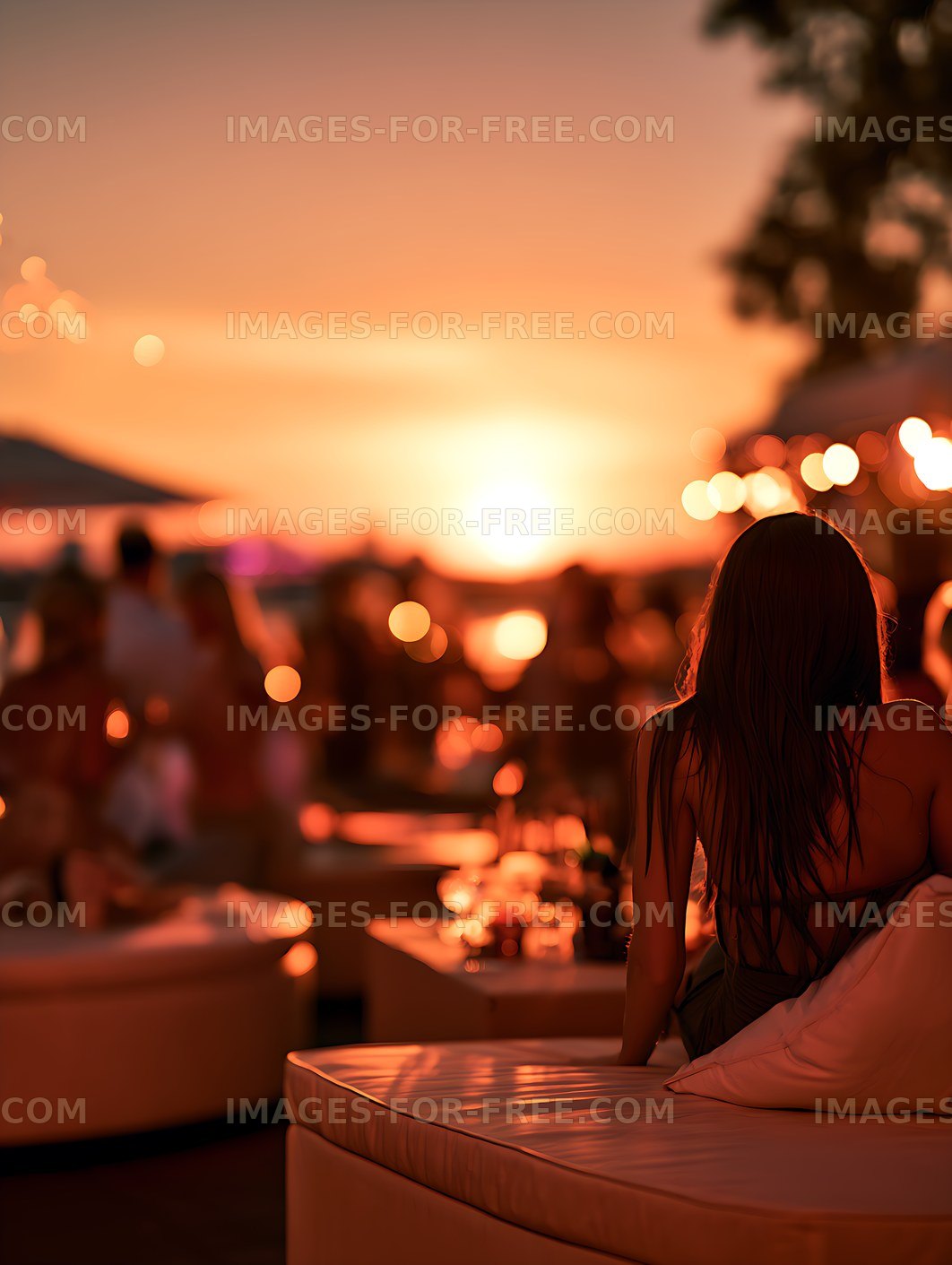 Woman Sitting on Rooftop at Sunset