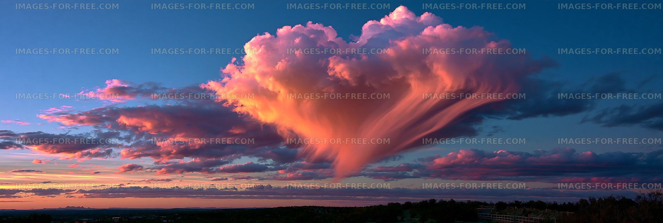Colorful sunset cloudscape above a distant horizon