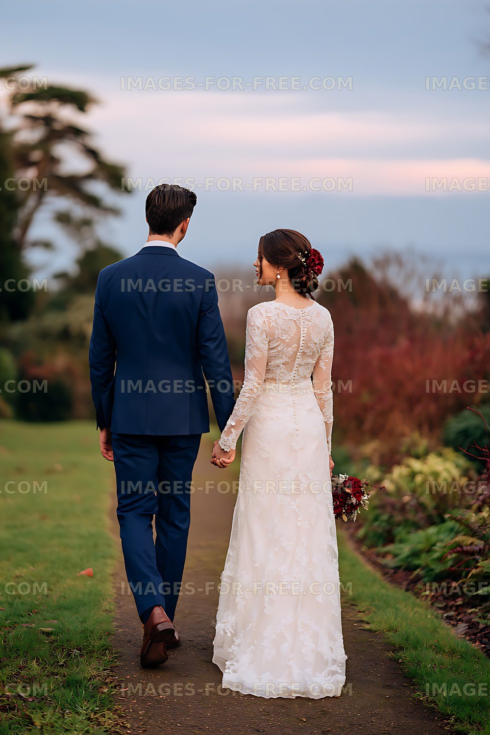 Bride and groom walking together through a landscaped garden