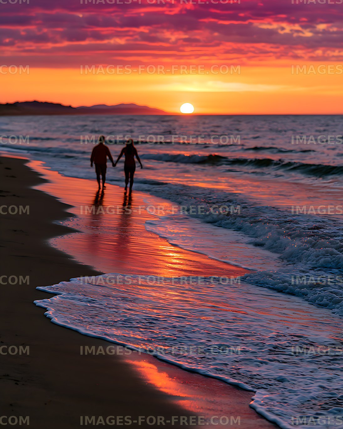 Two People Walking Along a Sunset Beach