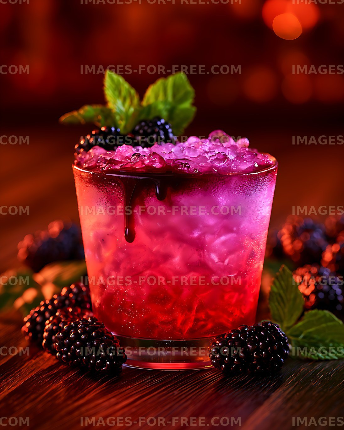 Colorful blackberry beverage with ice, mint, and fresh berries