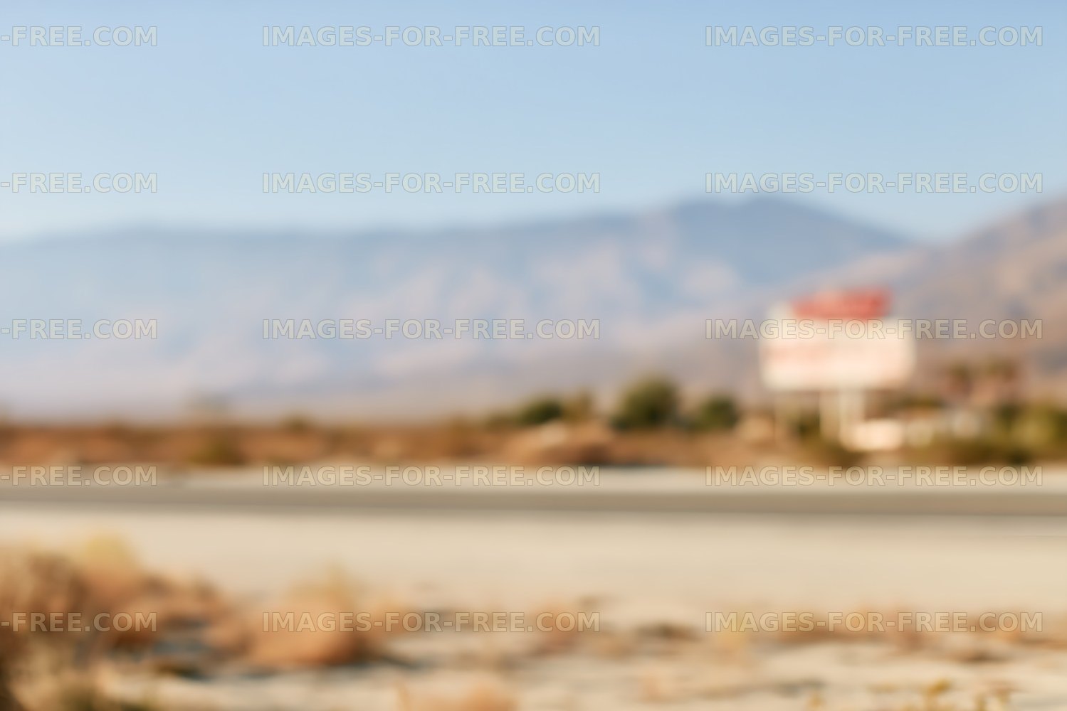 Soft focus desert road and mountain landscape