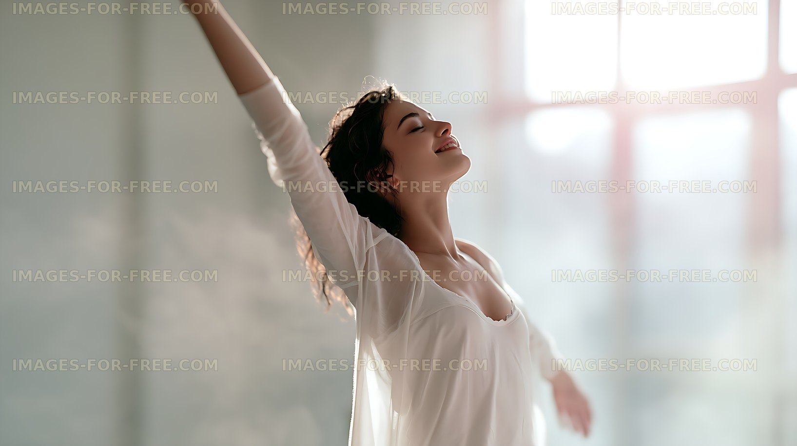 Joyful woman dancing in a bright room