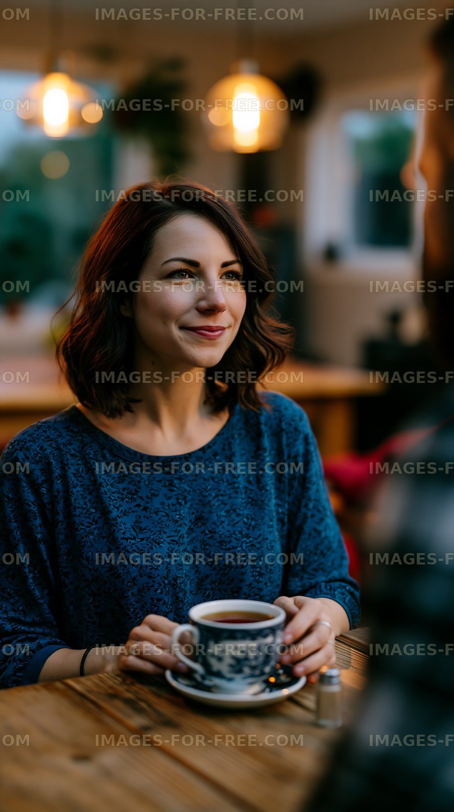 Woman enjoying coffee in a cozy cafe