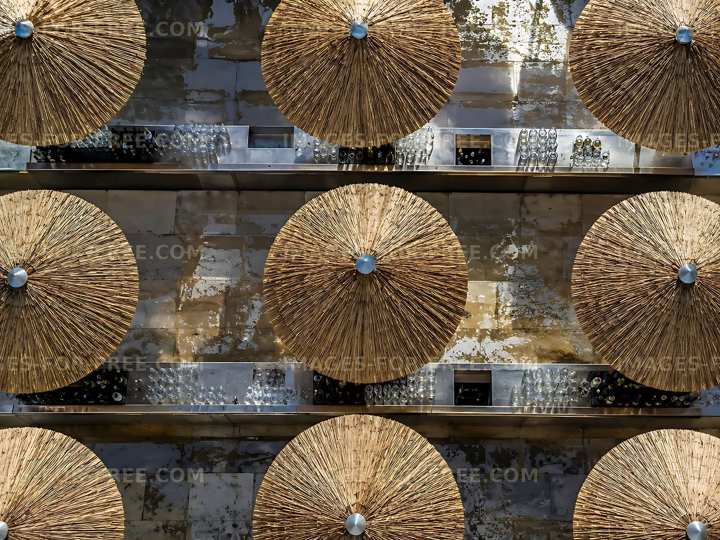 Roof of straw umbrellas arranged in a pattern