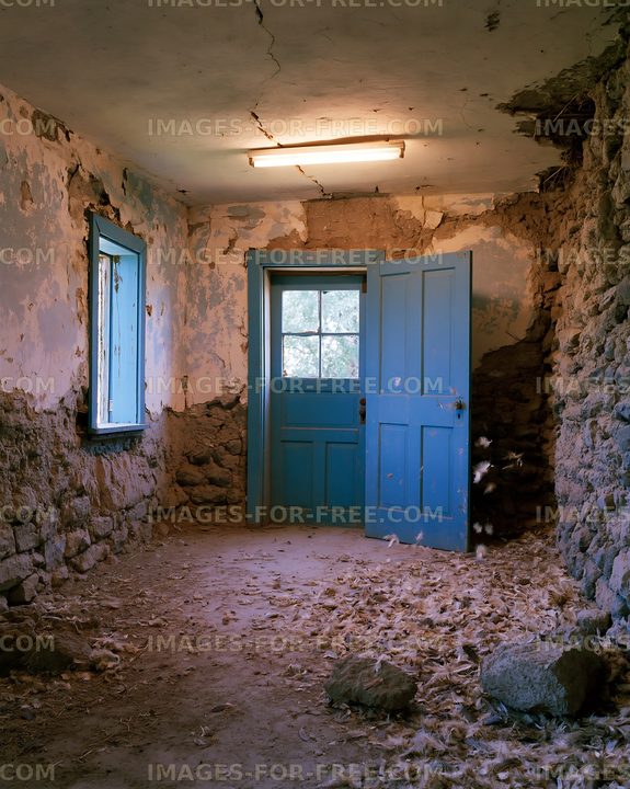 Abandoned room with blue doors and peeling walls