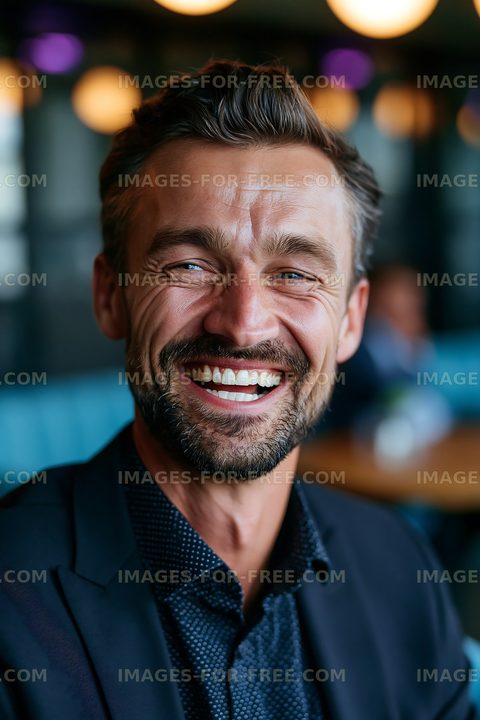 Man smiling in urban cafe setting with modern decor