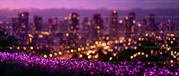 City skyline with purple flowers and blurred lights at dusk