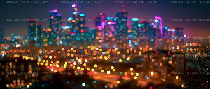 City skyline at night with colorful lights