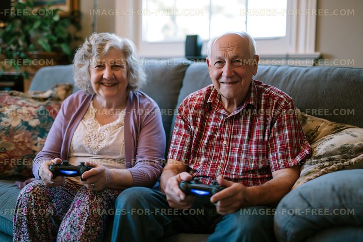 Elderly couple enjoying video games on the couch at home