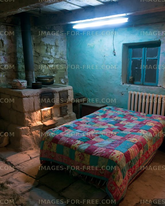 Cozy interior of a rustic bedroom with a quilt and stone stove