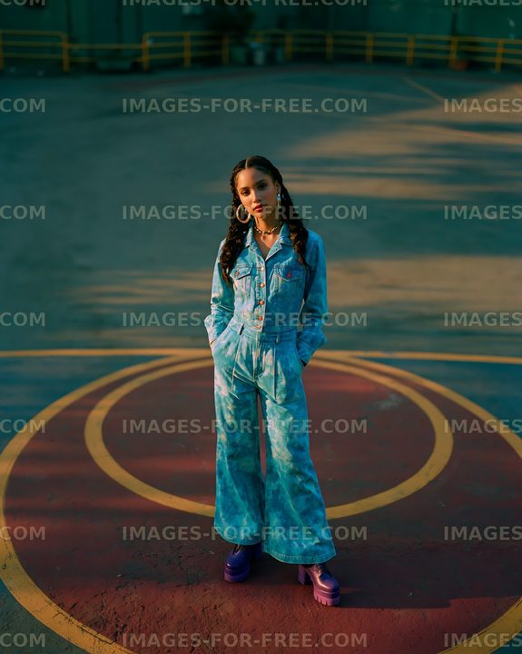 Young woman stands on painted circle in urban setting