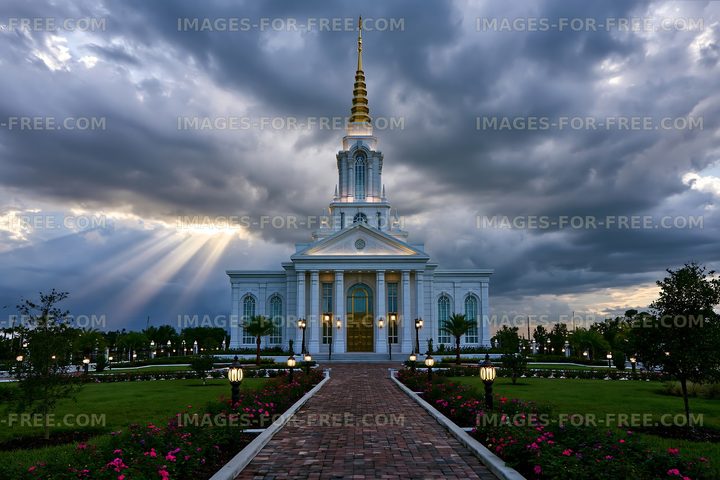 Historic temple under cloudy sky with sunlight breaking through