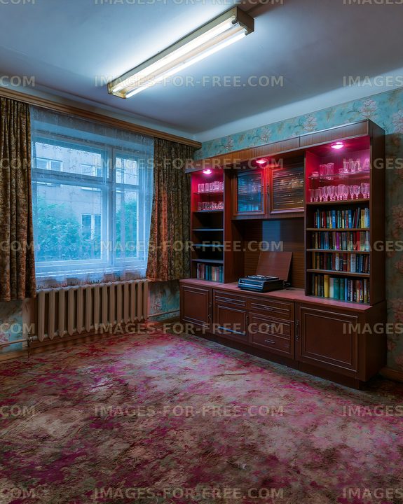 Old living room interior with bookshelf and window