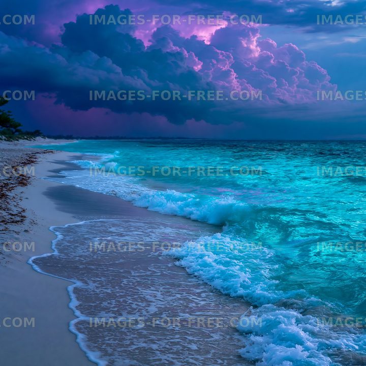 Colorful clouds over a beach with waves and calm water