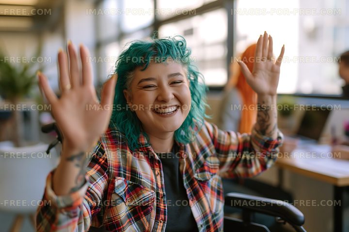 Woman with turquoise hair smiling in modern office space