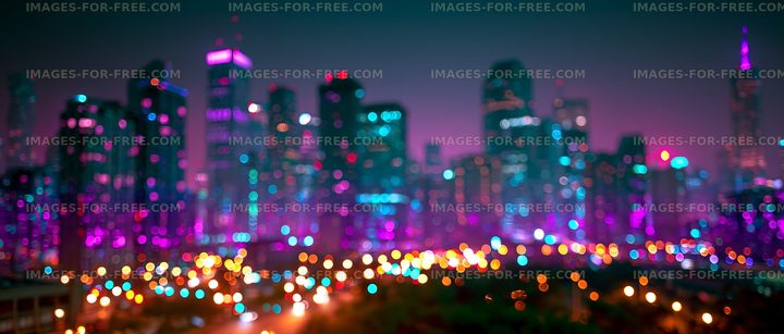 City skyline at night with colorful lights