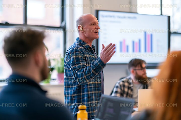 Business meeting with a speaker presenting data in a modern office