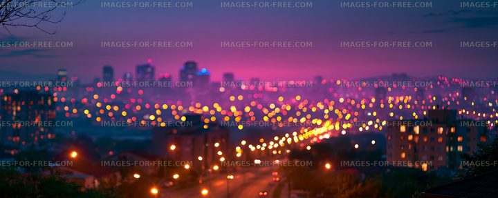City skyline at dusk with lights shining in the street