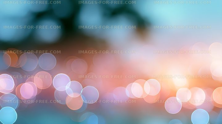 Colorful bokeh lights shine in a blurred background at dusk