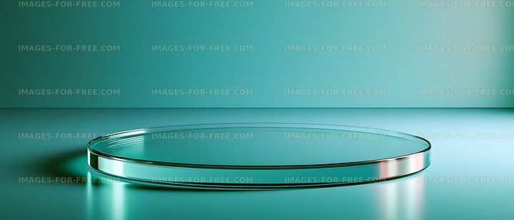 Clear circular glass platform in teal studio setting