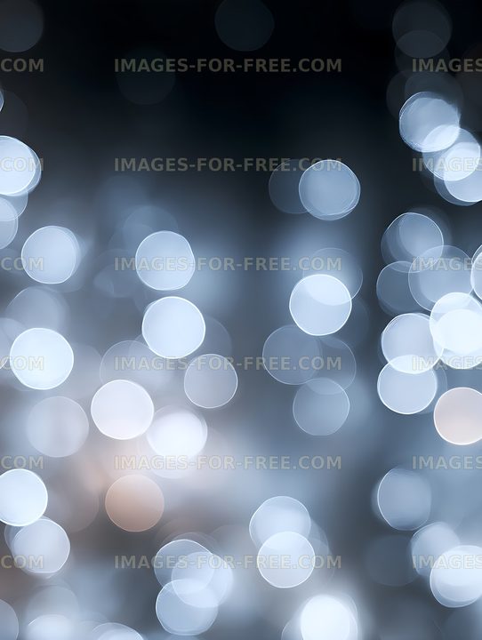 Soft glowing bokeh circles on a dark blue background