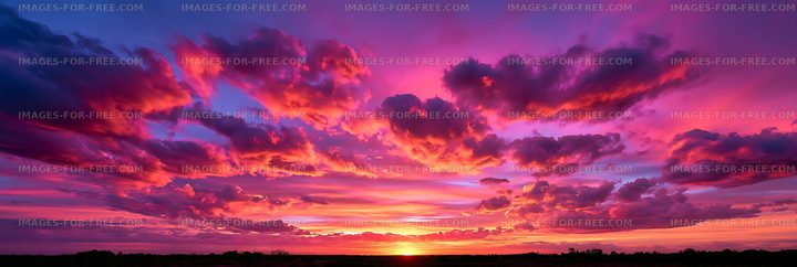 Colorful dramatic sunset clouds above a silhouetted horizon