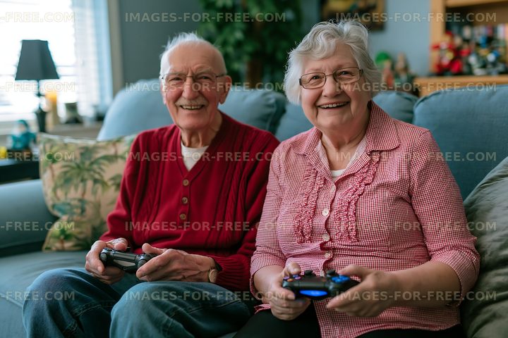 Elderly couple playing video games on a couch