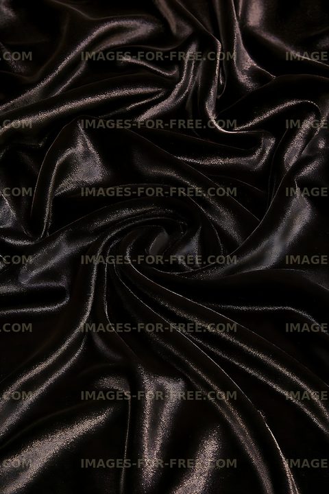 Glossy black textile with flowing folds