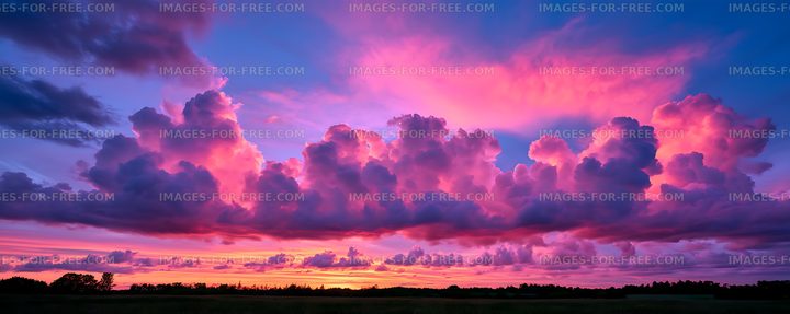 Dramatic colorful sunset cloudscape over rural landscape