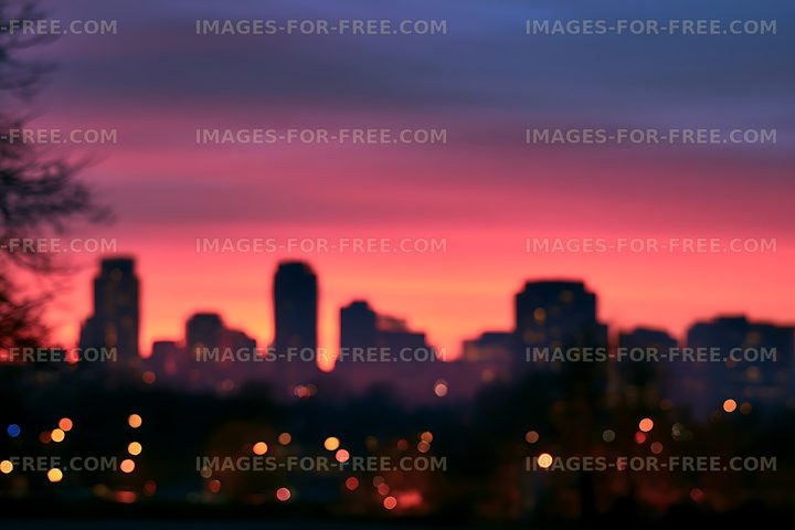 Soft focus urban skyline with bokeh at dusk