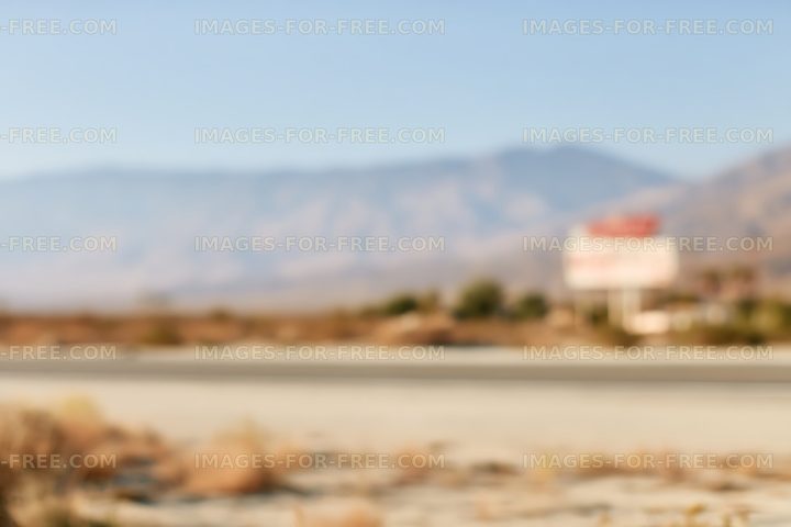 Soft focus desert road and mountain landscape